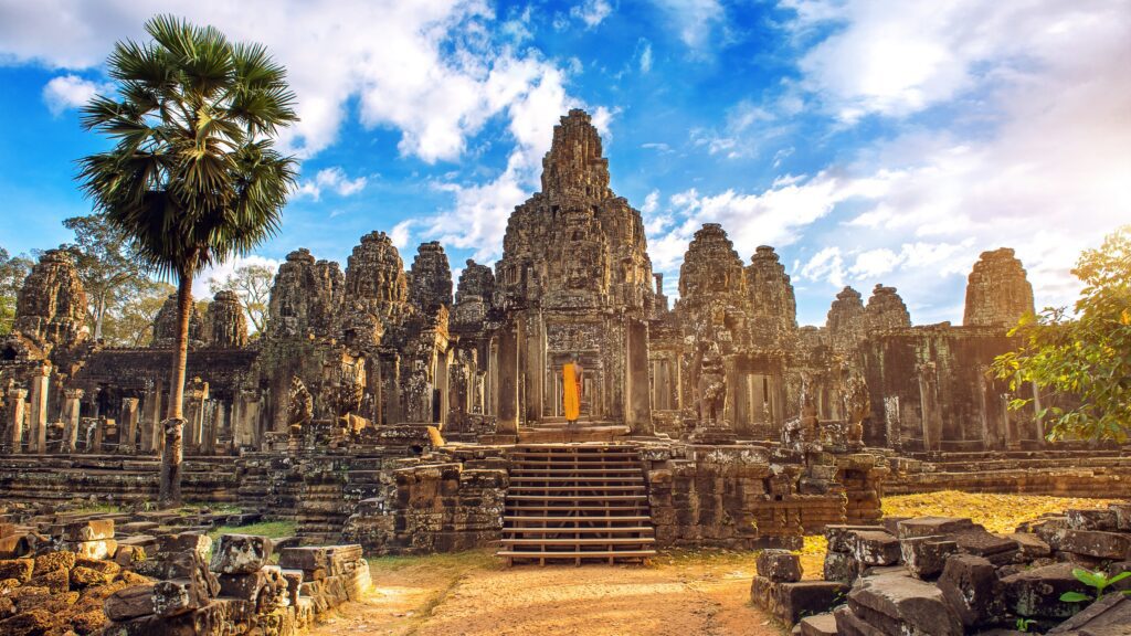 Cambodia Tours From USA / Ancient stone faces at sunset of Bayon temple, Angkor Wat, Siam