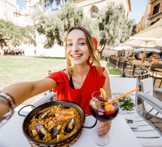 Woman with paella dish in Valencia