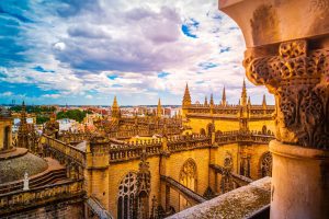 Spain Trip Packages / Aerial view of Seville city and Cathedral of Saint Mary of the See in Seville, Andalusia, Spain, Europe