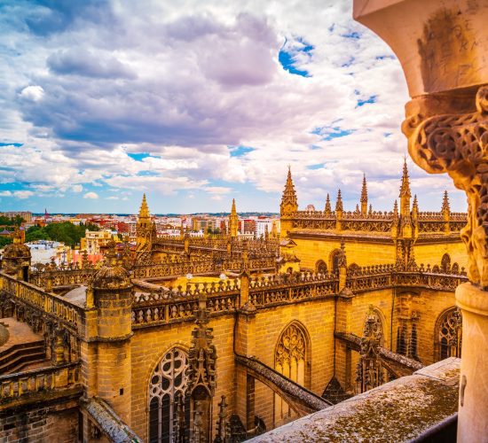 Spain Tours for Seniors / Aerial view of Seville city and Cathedral of Saint Mary of the See in Seville, Andalusia, Spain, Europe